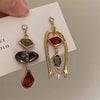 Vintage Humanoid-Shaped Hanging Earrings plated in 18K gold