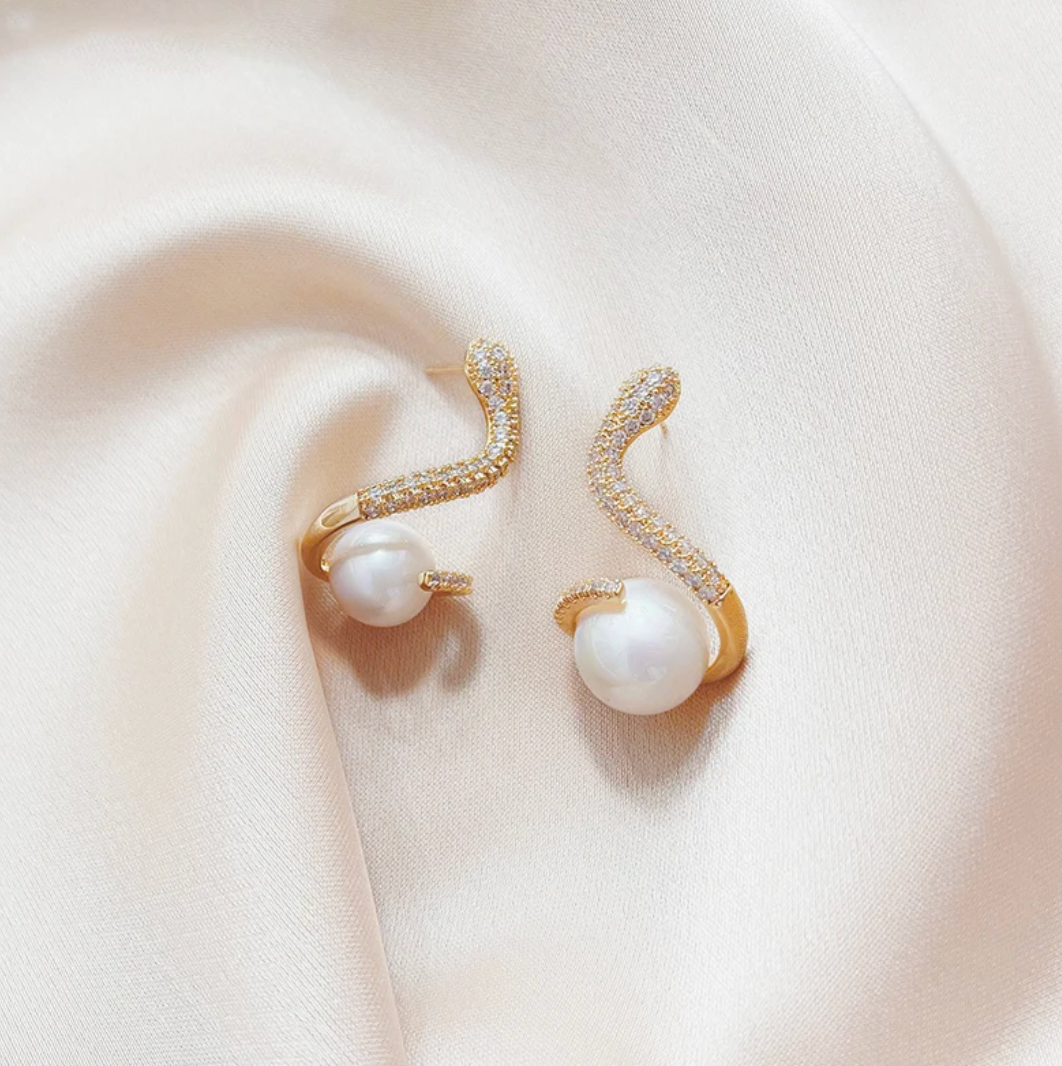 18 Karat Gold Plated earrings in the shape of a snake with pearl