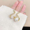 18 Karat Gold Plated earrings in the shape of a snake with pearl