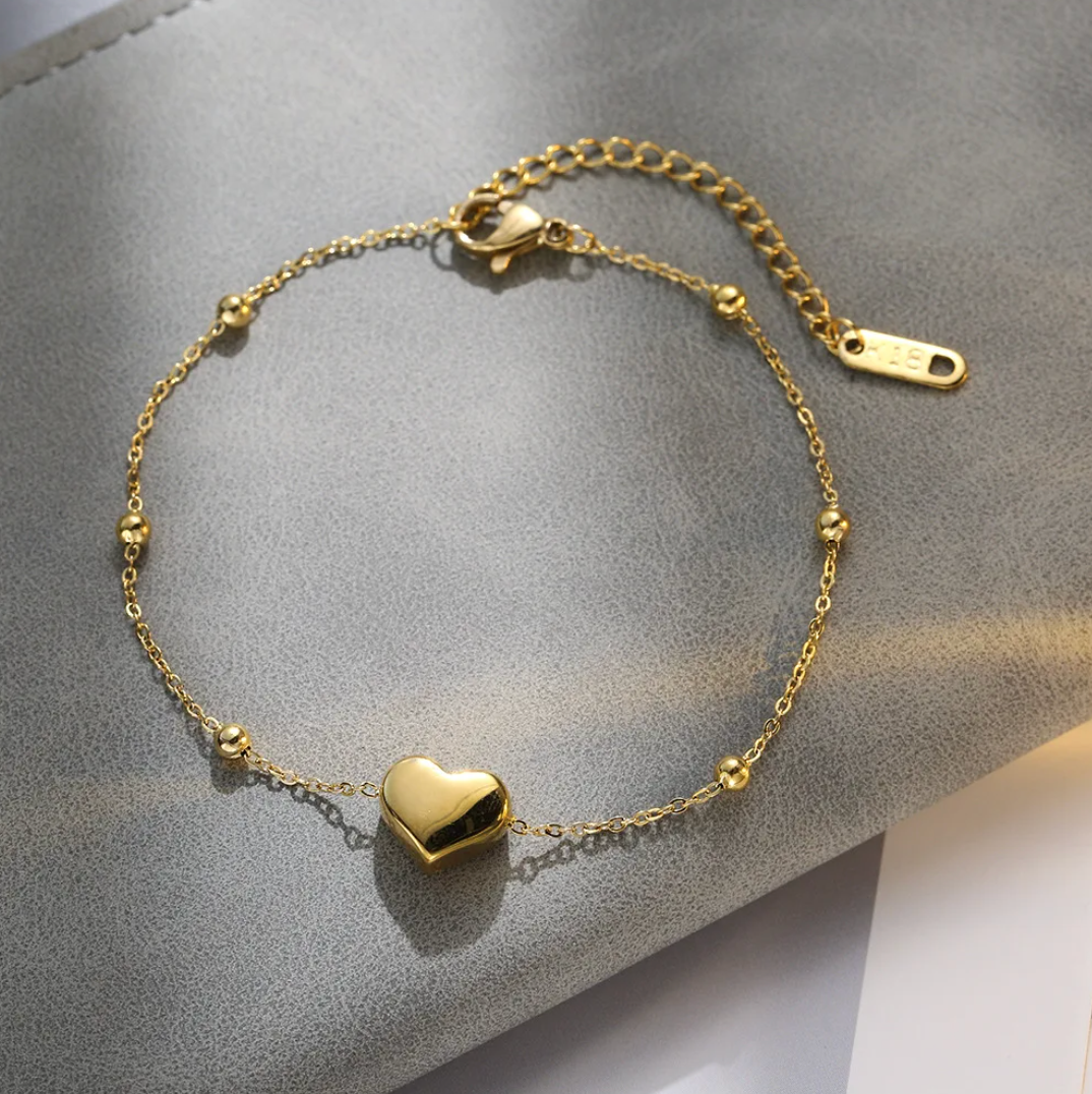 18 Karat Gold Plated bracelet with unique solid heart and beads