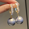 Earrings with natural pearls and blue enamel